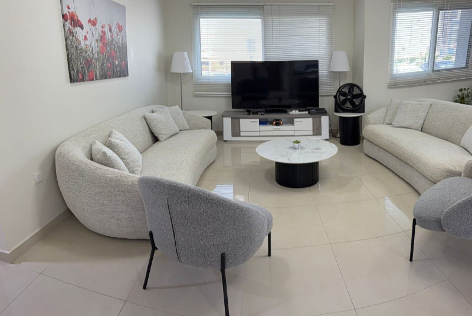 Living room in a Dubai Sports City apartment, original photo